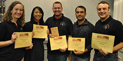 3rd place winners holding their awards.